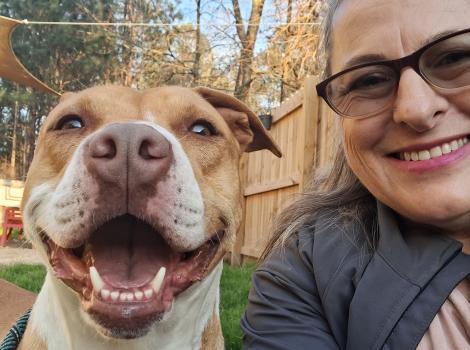 Mama the dog with a smiling woman